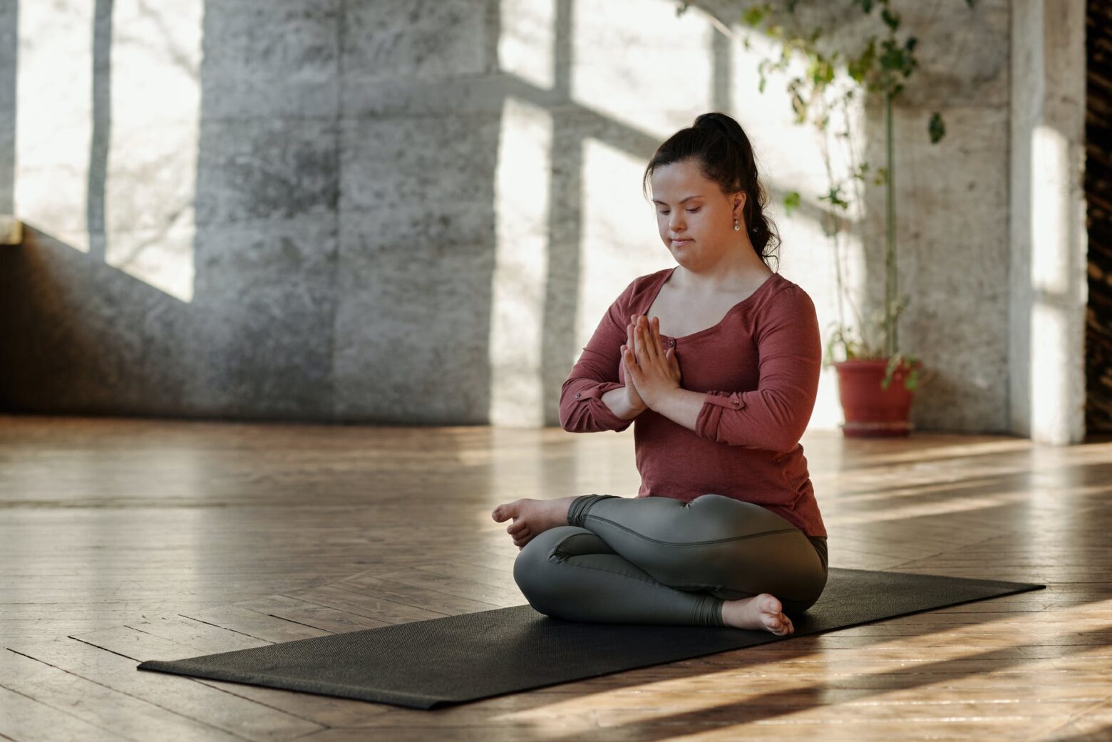 photo of woman meditating alone