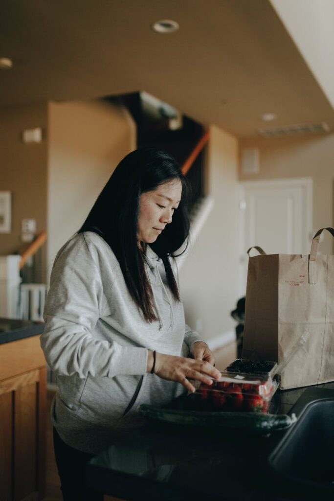 pcos weight loss - a mother putting out groceries from a paper bag